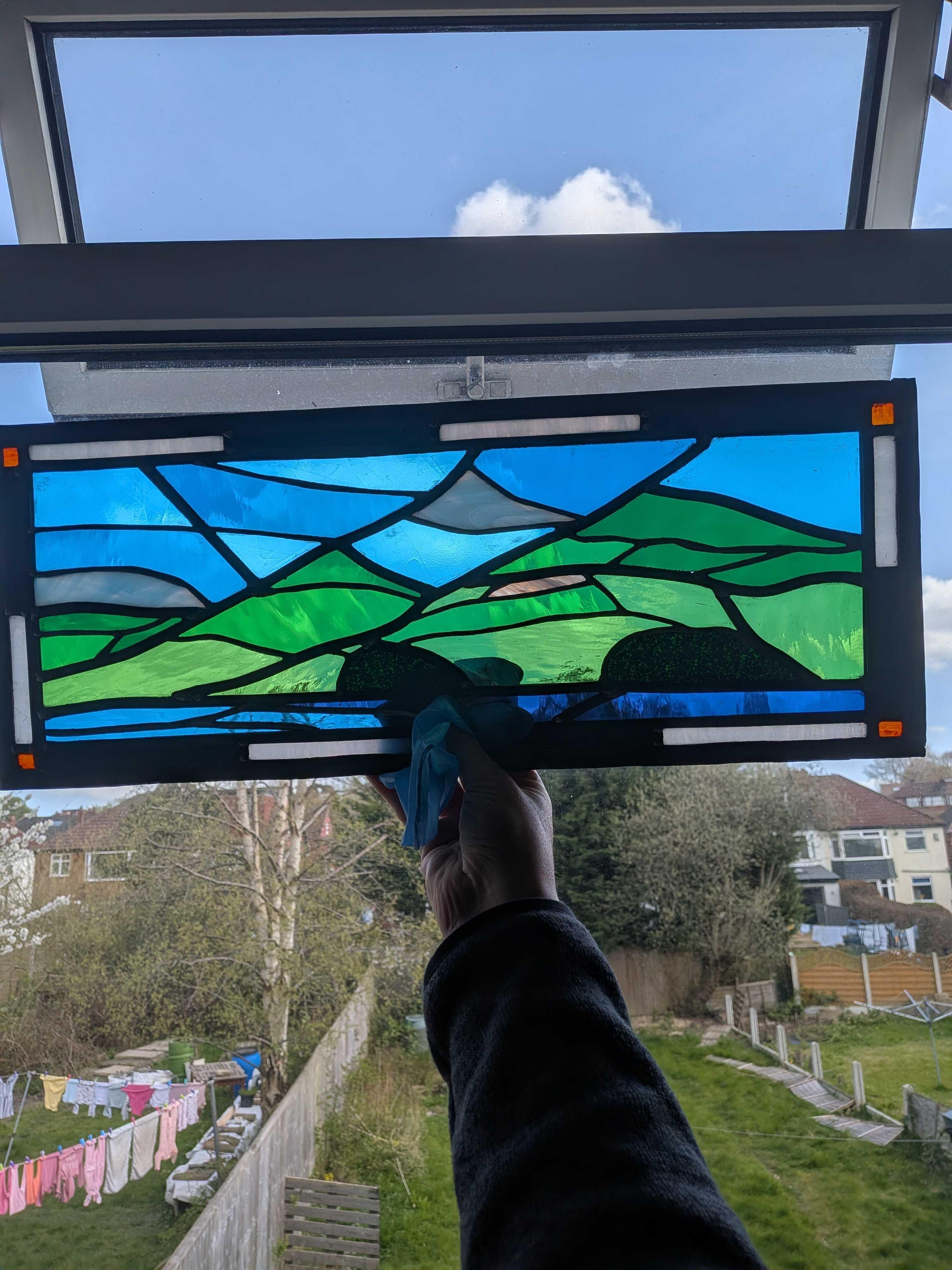 Stained glass window depicting the Peak District hills